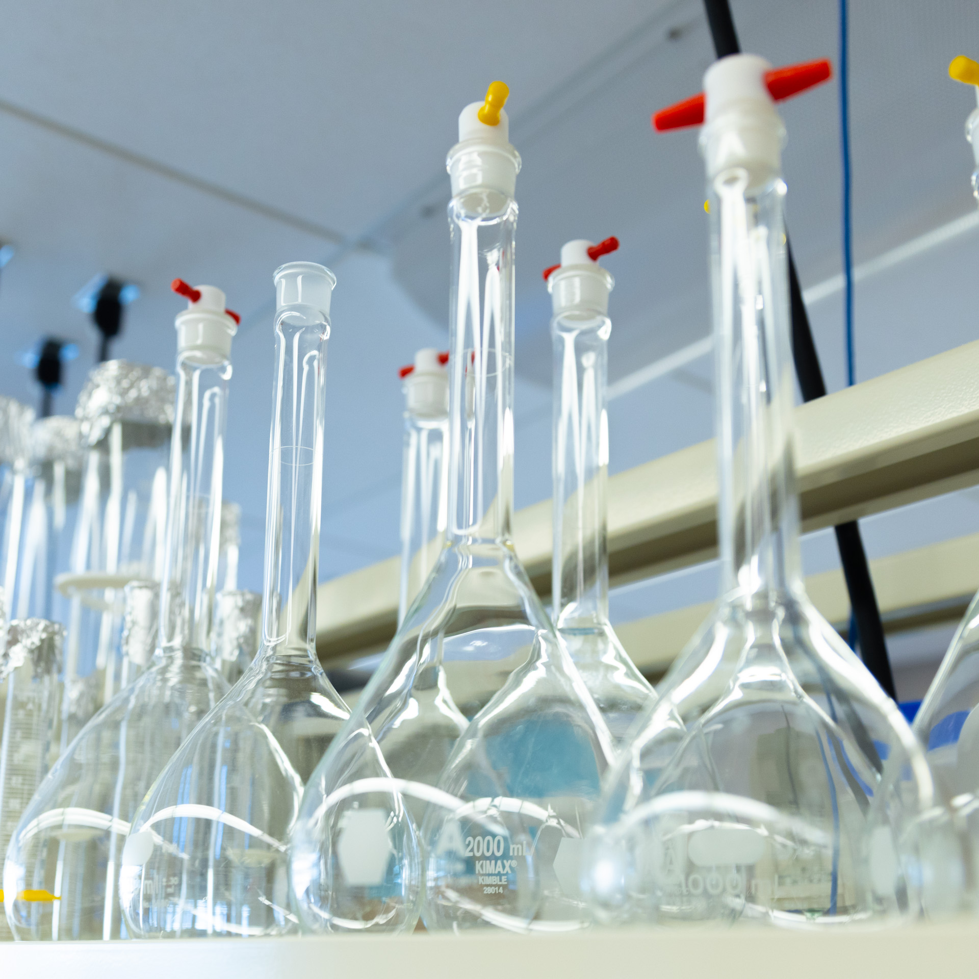 Sealed glass beakers in a storage room at the KU Innovation Park in Lawrence.